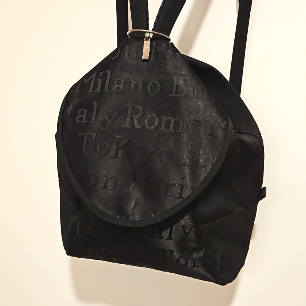Black backpack convertible bag international city names on sections EUC